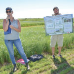 Rachel Evans showcases flax plots at the Westman Agricultural Diversification Organization site near Melita July 25.