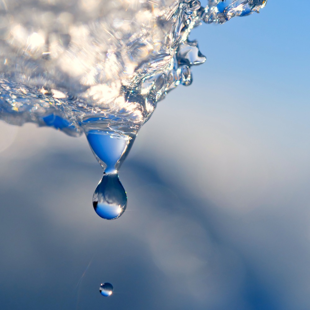 Drops of water falling from the melting ice.