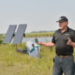 Manitoba Agriculture livestock specialist Ray Bittner explains the remote solar watering system at the Manitoba Beef and Forage Initiatives Brookdale site.
