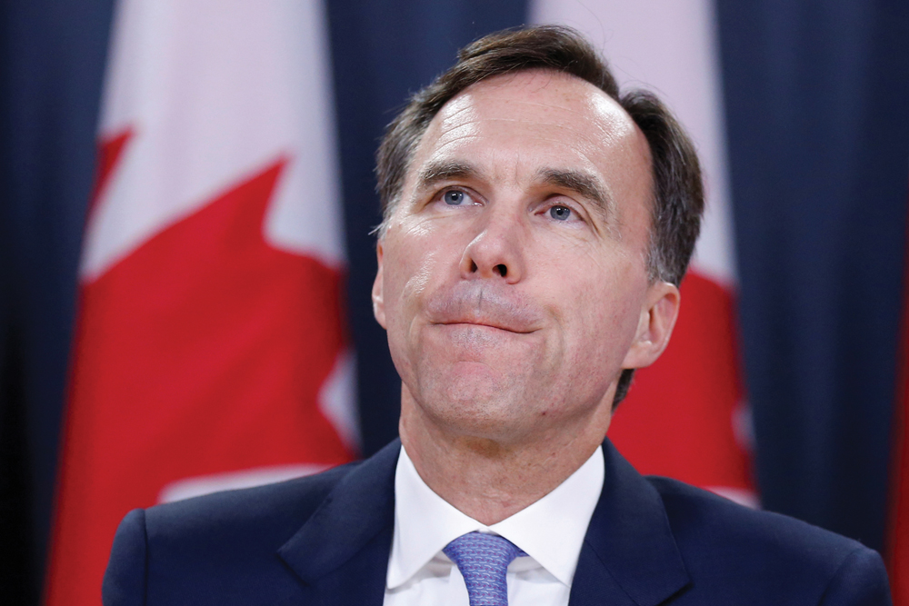Finance Minister Bill Morneau, seen here at an Ottawa press conference July 18 announcing tax changes,  has been getting a rough ride over the proposed policy.