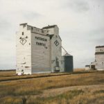 A 30,000-bushel wooden elevator at Fairfax in the Municipality of Grassland was built by Paterson Grain in 1920. Balloon annexes were built on two sides of it in the 1950s then they were replaced by a large crib annex and two steel tanks. This photo from October 1999 was taken shortly after the facility was closed. It was demolished the following year along with the former Manitoba Pool elevator (acquired by Paterson in 1981) in the background.