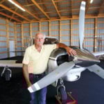 Don Dewar with his Comanche aircraft in Dauphin.