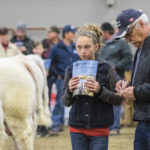 Kati-Leigh Heapy and her grandpa, Harry Airey of Rivers were two of the 60 judges that participated in the Charolais Wheat King Jackpot bull show, part of the breed’s national show at Ag Ex.