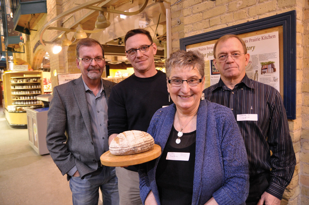 Scott Stothers (l to r), Loic Perrot, Tabitha Langel, and Doug Cattani with bread made from Kernza. 