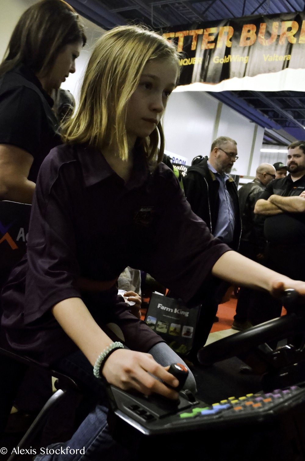 Ardyn Williams of Souris tries her hand at the wheel of a virtual combine Jan. 16, one of over 800 booths at Ag Days 2018.