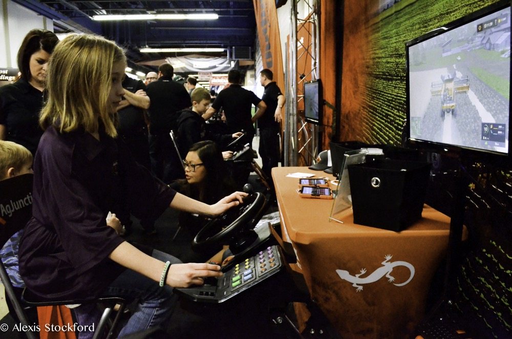 Ardyn Williams of Souris tries her hand at the wheel of a virtual combine Jan. 16, one of over 800 booths at Ag Days 2018.