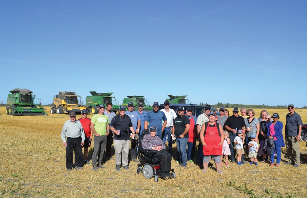 Supporters of the Arborg and District Growing project pose for a portrait on harvest day. Meaza Melkamu, (second from right), a policy adviser working for the Foodgrains Bank’s conservation agriculture program in Nairobi was on site to take part in the harvest gathering that afternoon.