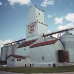 A 30,000-bushel elevator at La Salle, on the CPR La Riviere Subdivision in the Rural Municipality of Macdonald, was built in 1938 by the Paterson Grain Company using materials salvaged from a demolished elevator at Dumas, Saskatchewan. It replaced an earlier elevator built around 1912 by local farmer Moise Cormier and sold to Paterson in 1916. Balloon annexes were built beside the elevator in 1940 and 1955, increasing its capacity to 89,000 bushels. The annexes were subsequently replaced by six steel tanks between 1986 and 1988. Operated by a part-time manager, the facility is used to store beans.