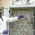 Agriculture and Agri-Food Canada researcher, Sijo Joseph, goes over the finer points of a recently installed model stomach.