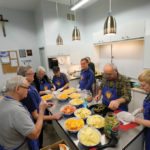 Volunteers prepare lunch at the annual St. Jean Farm Days.