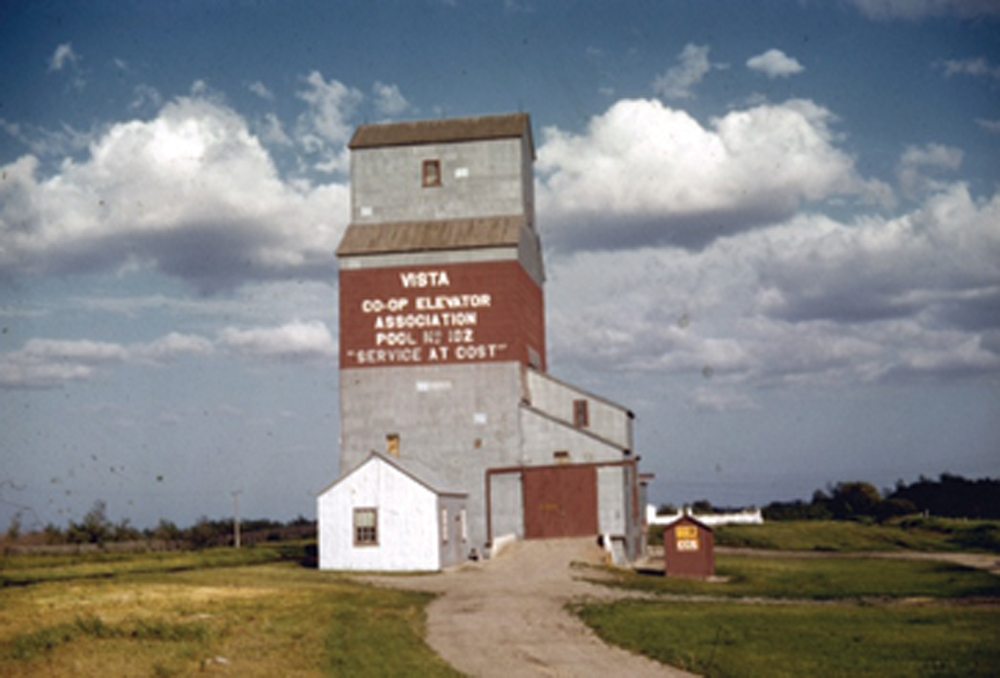 A 30,000-bushel grain elevator at Vista, on Highway 45 east of Rossburn, was built by Manitoba Pool Elevators in 1940 for a local co-operative association. Two steel tanks were built beside it in 1964 and, in July 1968, the facility was closed then, a few months later, sold to United Grain Growers, becoming UGG’s second elevator at the site. UGG also bought the residence used by the Pool managers. Both elevators have since been removed from the site.