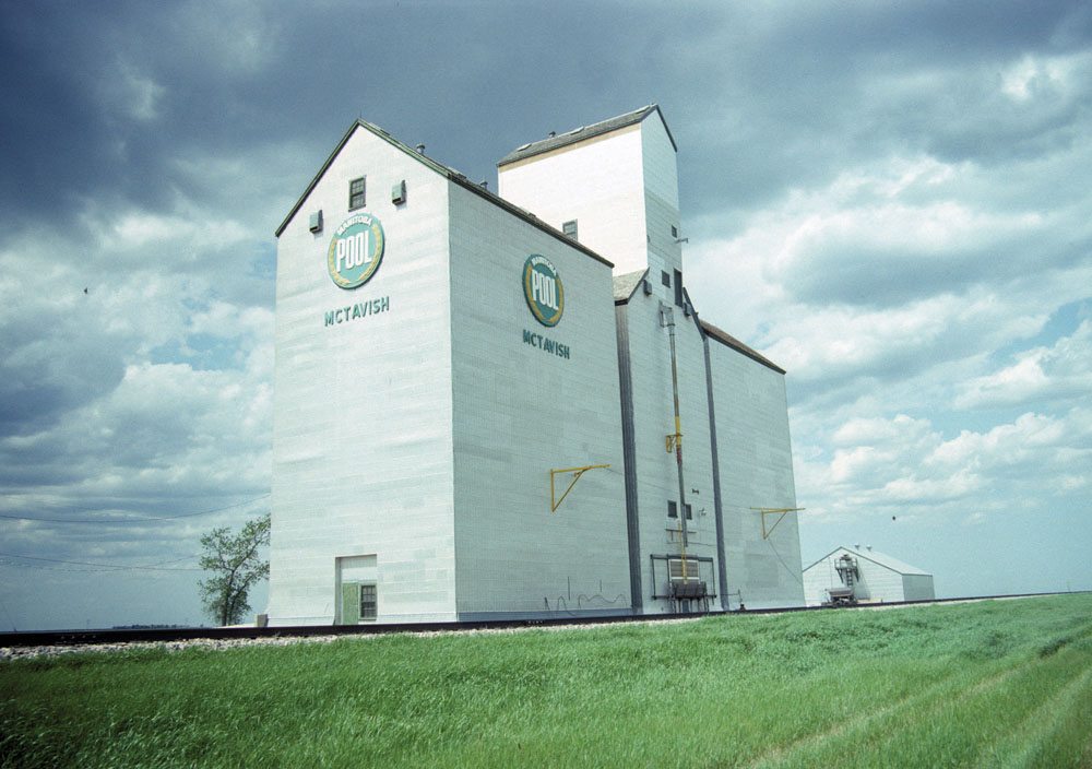 A 40,000-bushel wooden grain elevator at McTavish, in the Rural Municipality of Morris, was built in 1937 by Manitoba Pool Elevators. For increased storage capacity during the Second World War, two temporary balloon annexes were built in 1940-41 and 1941-42. They were replaced by a single crib annex in 1966, joining an Overgaard annex built in 1954, raising its total capacity to 158,000 bushels. Extensive renovations were made in 1970 and 1977. Closed by Agricore in 2002, the elevator was demolished in 2003.