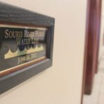 A small sign in the foyer of the Riverside Holiday Inn in Minot, North Dakota reminds visitors how high the water reached in 2011 when the Souris River flooded to its highest levels since at least 1881.