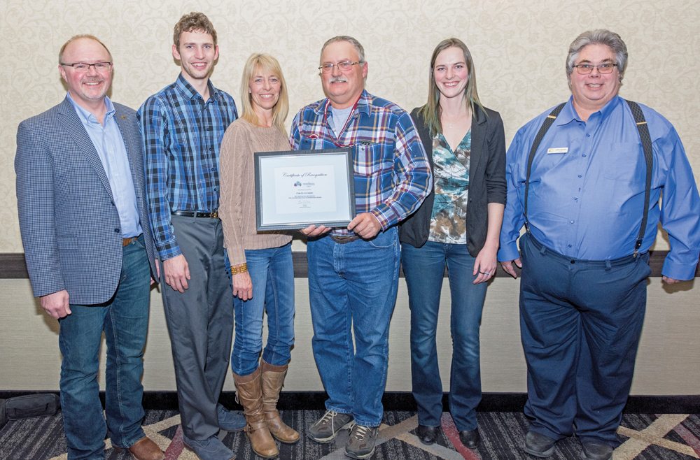 (From left) Tere Stykalo of award sponsor, MNP, poses with TESA award winners Thomas Harper, Sonja Harper, Brian Harper and Kristelle Harper of Circle H Farms, along with Larry Wegner, chair of MBP’s Environment Committee. The Environmental Stewardship Award for Manitoba (TESA) was presented at the Manitoba Beef Producers President’s Banquet Feb. 8 in Brandon.