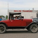 Shawn Airey drives one of the Clack Museum cars (a 1924 Model 490 Coupe) in the Rivers Agricultural Fair Parade accompanied by Kate-Leigh Heapy. 
