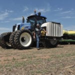 Farmer Darrin Eck with his tractor and cotton planter near Harper, Kansas, May 11, 2018.