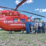 STARS pilot Ian Bonnell poses with members of the Verwey family.