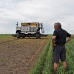 Norbert Beaujot, founder of SeedHawk and inventor of many seeding equipment innovations,
observes the Seedmaster DOT at Ag in Motion 2018.