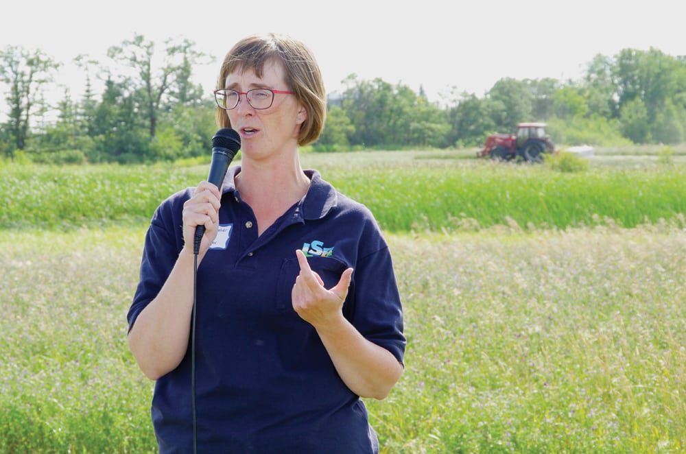 Local ALUS co-ordinator and conservation district manager, Colleen Cuvelier, explains one of several perennial forage projects ALUS is funding in the Little Saskatchewan River Conservation District during a July 2018 field tour.
