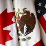 Flags are pictured during the fifth round of NAFTA talks involving the United States, Mexico and Canada, in Mexico City, Mexico, November 19, 2017.