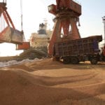 Workers transport imported soybeans at a port in Nantong, Jiangsu province,
China April 9, 2018.