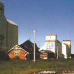 In this 1971 photo of Swan Lake, we see the local train station near four elevators, all of them gone today. From left to right (east to west), we see the Federal elevator built in 1954 that was sold to Manitoba Pool in 1960 then traded to UGG in 1971 (but the Federal name remained on it); then the UGG elevator built in 1925; then the Paterson elevator dating from 1924
with its crib annex (1953) and balloon annex (1940); and finally the 1928 Manitoba Pool elevator traded to UGG in 1974
and burned in 1988.