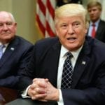 U.S. President Donald Trump talks to the media next to Secretary of Agriculture Sonny Perdue during a roundtable discussion with farmers at the White House in Washington, U.S. April 25, 2017.