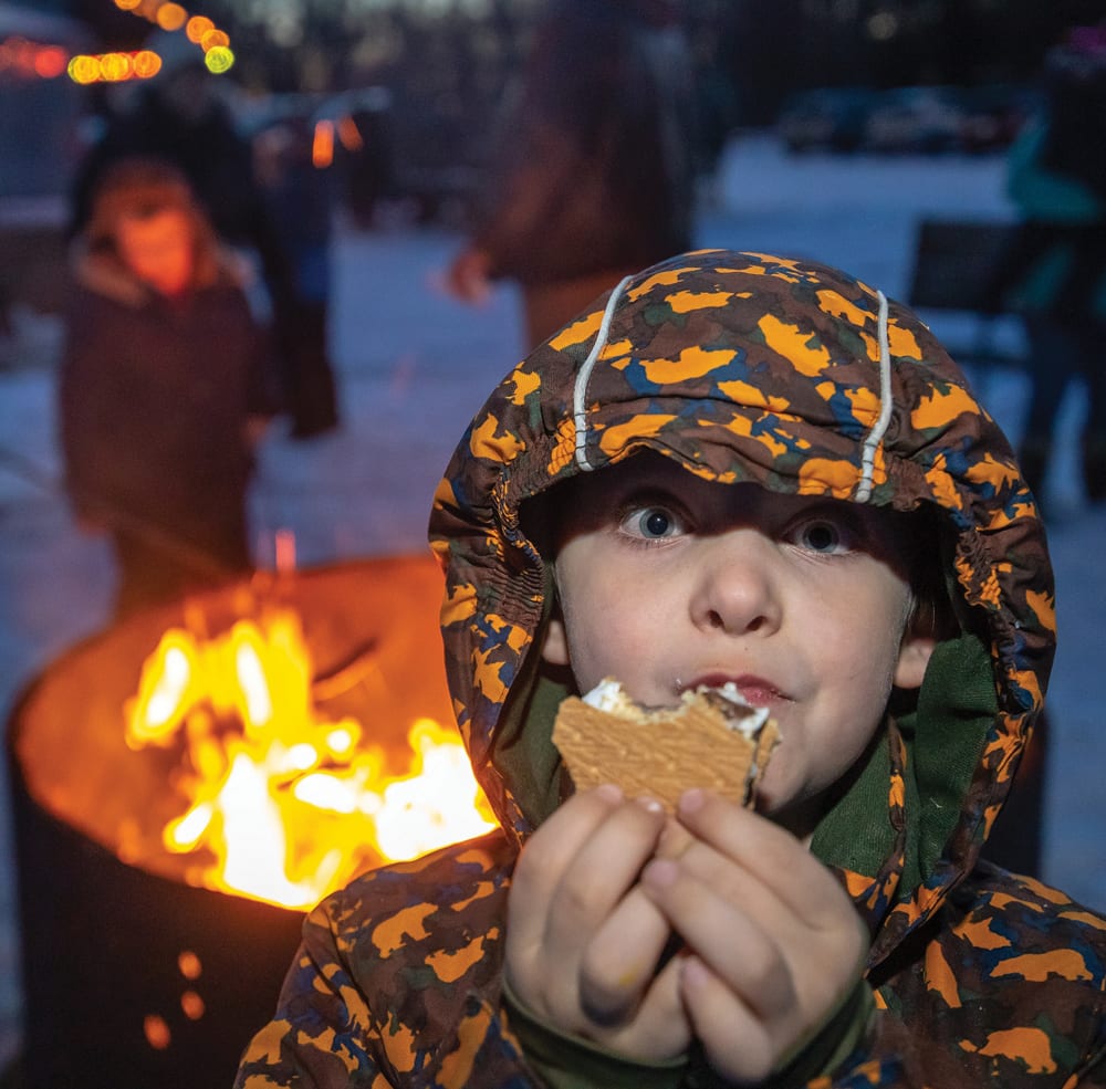Jackson Pohl of Austin enjoys a bonfire-baked s’more. 