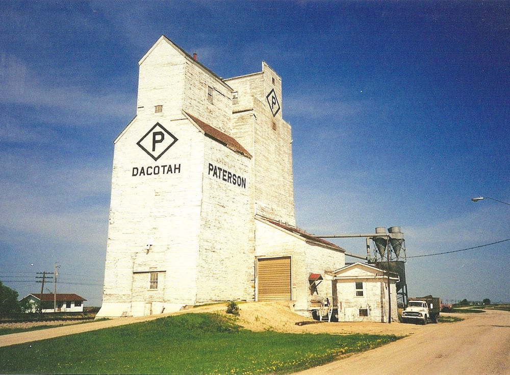 The Paterson Grain elevator and annex at Dacotah, on the CNR Gladstone Subdivision in the RM of Cartier, was comprised of two elevators sitting side by side. The one in the rear of this photo was built in 1957 while the nearer one was constructed in 1917 and moved here in 1971 from Cabot, a siding on the CNR Cabot Subdivision a few kilometres away. The entire facility was demolished in August 2003.