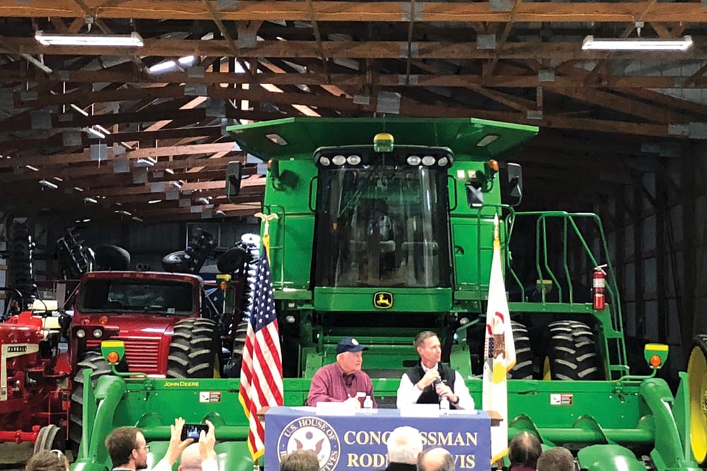 U.S. Agriculture Secretary Sonny Perdue (l) and U.S. Representative Rodney Davis of Illinois take farmers’ questions at a farm in Champaign, Illinois October 24, 2018.