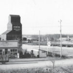 In this view of Argyle taken from a window of the local schoolhouse, circa 1950, we see a 30,000-bushel elevator constructed around 1941 by Federal Grain to replace a smaller structure built in 1918 by local businessman and MLA Arthur J. Lobb. Sold to Manitoba Pool in 1972, the elevator was dismantled between 1972 and 1973. Lobb also built the general store in the foreground and it remains in operation today, as does the schoolhouse.