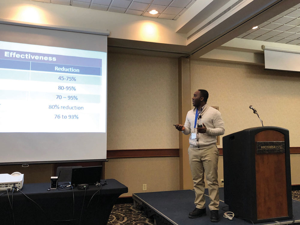 Desmond Essien speaking at the New and Emerging Research session on December 12 at the Prairie Livestock Expo in Winnipeg.