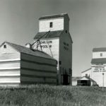 In 1929, the CPR announced that two elevators at the siding of Chillon, about four miles southeast of Binscarth, shipped more grain than 80 per cent of the other elevators in Manitoba. Seen here in the 1960s, Pool A at right was built between 1921 and 1922 by Paterson Grain. Sold to Manitoba Pool in 1928, its capacity was expanded in 1952 with a large balloon annex. The Pool B elevator at left was built in 1921 by United Grain Growers, expanded in 1952, and sold in 1960. The elevators were closed in mid-1971 and dismantled in 1972.