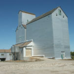 An elevator at Dunrea was built in 1928 by Manitoba Pool Elevators. In 1968, its 70,000-bushel capacity was expanded by a 110,000-bushel crib annex. Renovated in 1983 and 1987, the facility was closed by Agricore in mid-2001 and sold into private hands. In mid-March 2006, a blaze in the facility was fought by firefighters from Dunrea, Ninette, and Killarney. The wood burned down to the level of grain in the bins, some of which was later salvaged, and the remainder was demolished.
