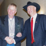Martin Unrau (left) receives his lifetime achievement award from Tom Teichroeb, Manitoba Beef Producers president, February 7.