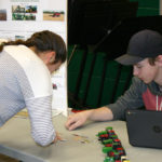 Teacher Chelsey Kostesky was asked to sort grain product pieces as part of Keegan Gamey’s project on Advancement in Ag Technology.