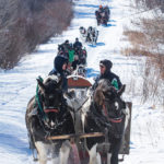 Grant Millar and Rob Warkentin of Virden chat as the line of 30 sleighs from the south make their way up into the park.