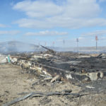 The Doerksens’ layer barn the day after the fire. Much of the metal sheeting from the exterior was pulled away to access the fire and is stacked off to the side. The fire is estimated to have caused $2.5 million in damages.