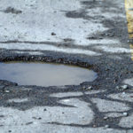 Pot Hole On City Street, A Hazard To Motorists