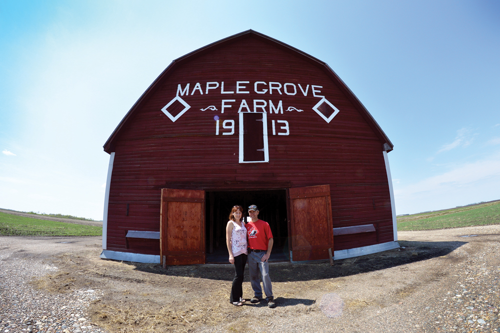 Jeff and Sheila Elder with their red, “Eaton’s barn,” which stands just north of Wawanesa, Manitoba.
