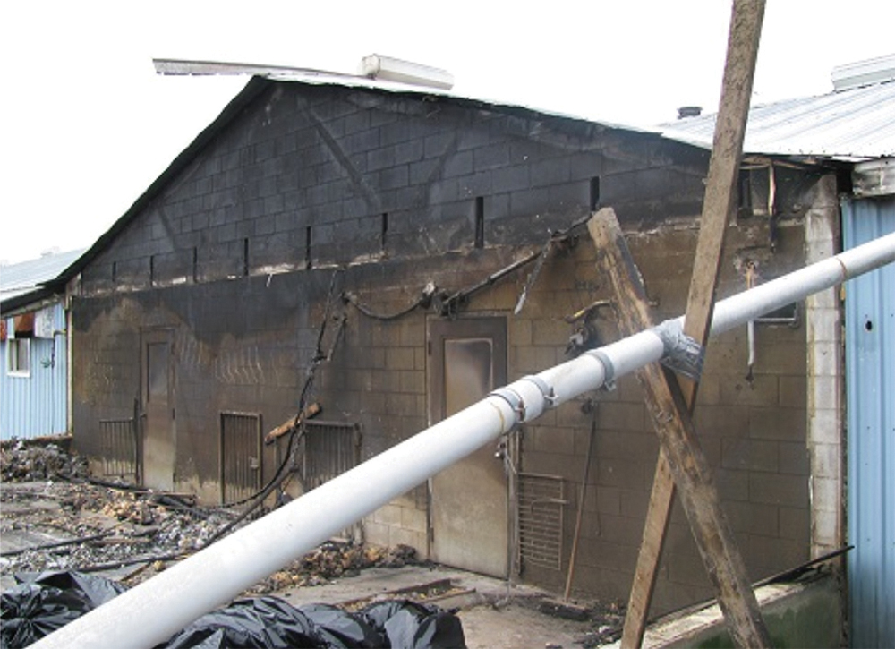 This is an example of an intact fire separation that did its job and prevented fire from spreading through the barn.