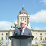 Bill Campbell, president of Keystone Agricultural Producers, addresses reporters outside of the Manitoba legislature on July 2.