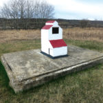 An elevator at Millwood, southwest of Russell near the Saskatchewan border, was built in 1957 by Manitoba Pool to replace a 55-year-old elevator destroyed by fire the previous year. It was closed in July 1971 and later removed from the site. A concrete monument, sitting on what appears to be a remnant of the former elevator, lists the names of founding directors for the local Pool Association.