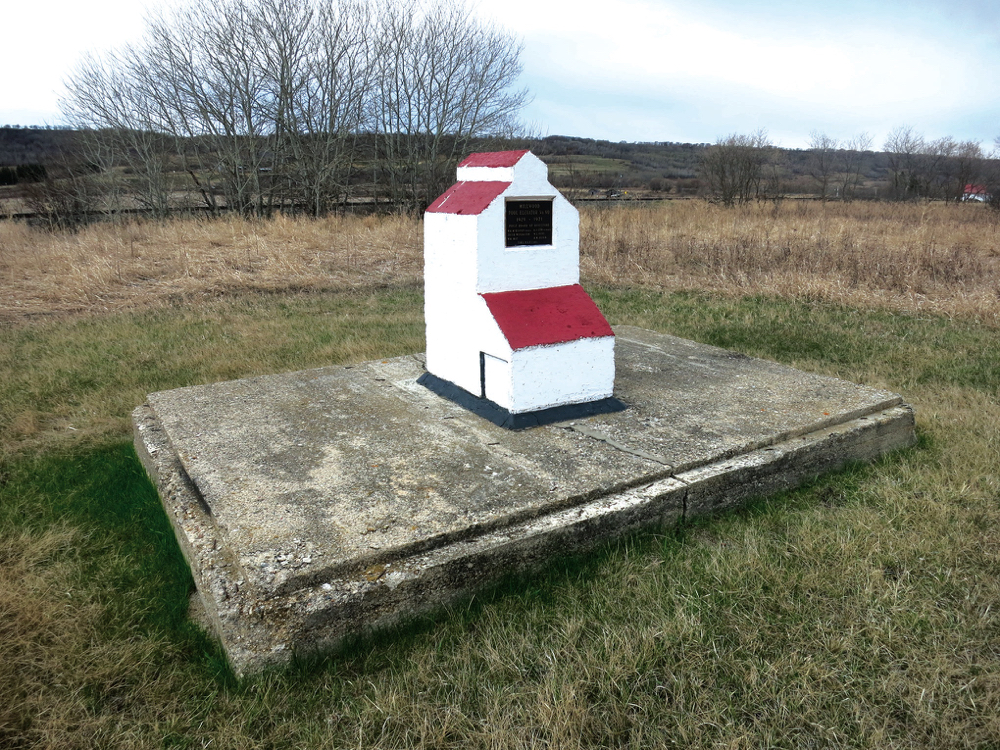 An elevator at Millwood, southwest of Russell near the Saskatchewan border, was built in 1957 by Manitoba Pool to replace a 55-year-old elevator destroyed by fire the previous year. It was closed in July 1971 and later removed from the site. A concrete monument, sitting on what appears to be a remnant of the former elevator, lists the names of founding directors for the local Pool Association.