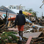 A man walks through the rubble in the aftermath of Hurricane Dorian on the Great Abaco island town of Marsh Harbour, Bahamas on Sept. 2.