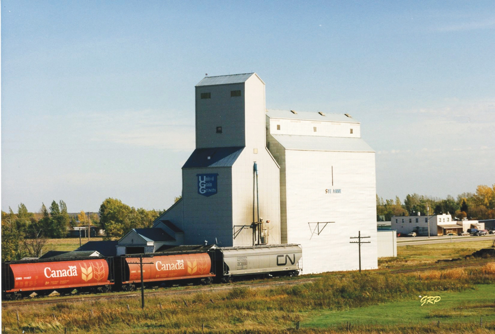 Ste. Anne UGG: A 35,000-bushel elevator at Ste. Anne was built by McCabe Grain in 1937 and expanded with a temporary annex in 1951. Sold to United Grain Growers in March 1968, a 78,000-bushel crib annex was built beside it in 1972. Closed in January 2001 a few months before the merger of UGG with Agricore, the elevator was demolished later that year.