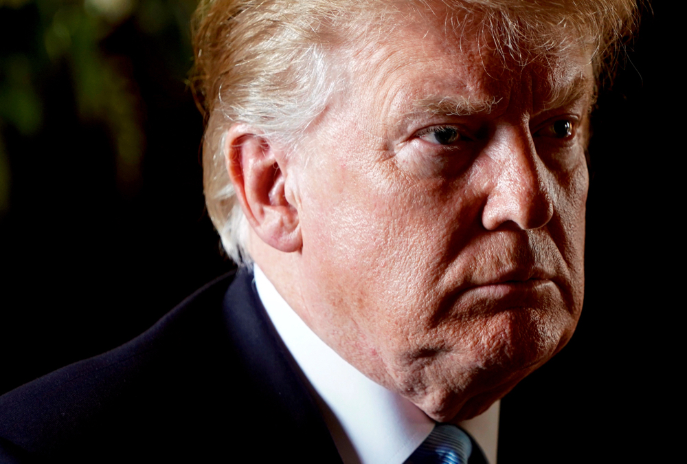 U.S. President Donald Trump listens to a question as he speaks to reporters, March 29, 2019.