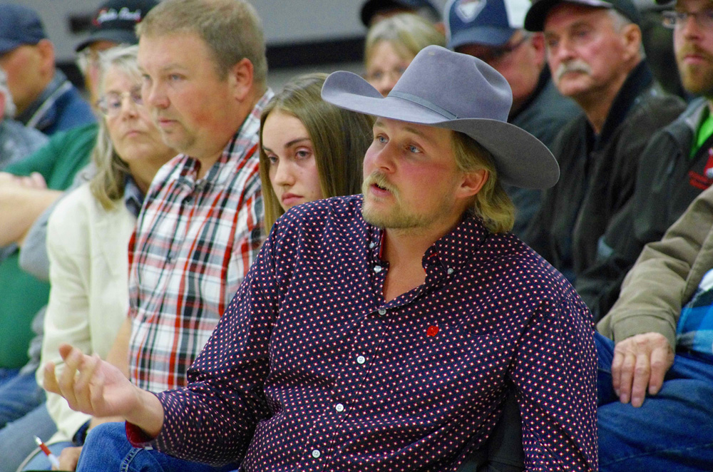 Dakota Sorensen of Eddystone (right) expresses his concern during a public meeting on Crown land lease changes in Ste. Rose du Lac Oct. 15.