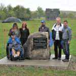 Peter Galawan (far left), poses with family members and MHHC staff pose with a cairn honouring Galawan for his donation. Left to right: Peter Galawan, Debbie McDowell (niece of Peter), Carol Graham (MHHC habitat conservation specialist), Ernest DeLaRonde (nephew of Peter), Gary Galawan (nephew of Peter) and Curtis Hullick (MHHC field manager).