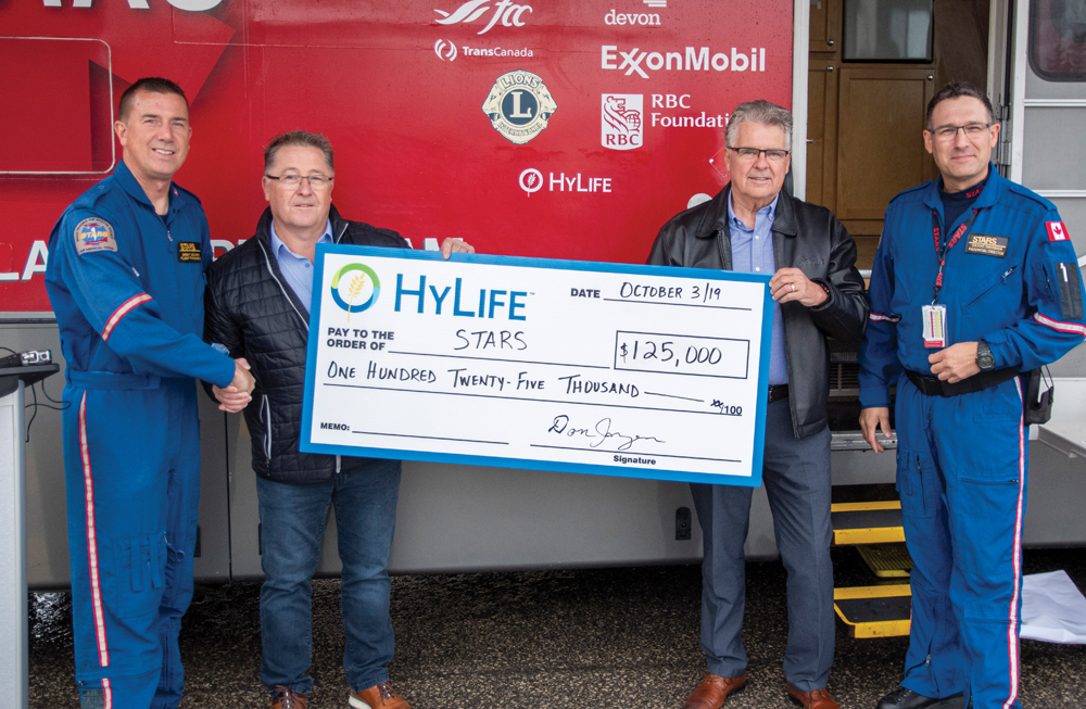 HyLife officially announced a gift of $125,000 to STARS air ambulance at Bethesda Regional Health Centre in early October. From left to right: Brent Bekiaris, STARS flight paramedic and mobile education leader; Grant Lazaruk, HyLife CEO; Don Janzen, HyLife chairman and Grant Therrien, STARS director of Manitoba operations. 